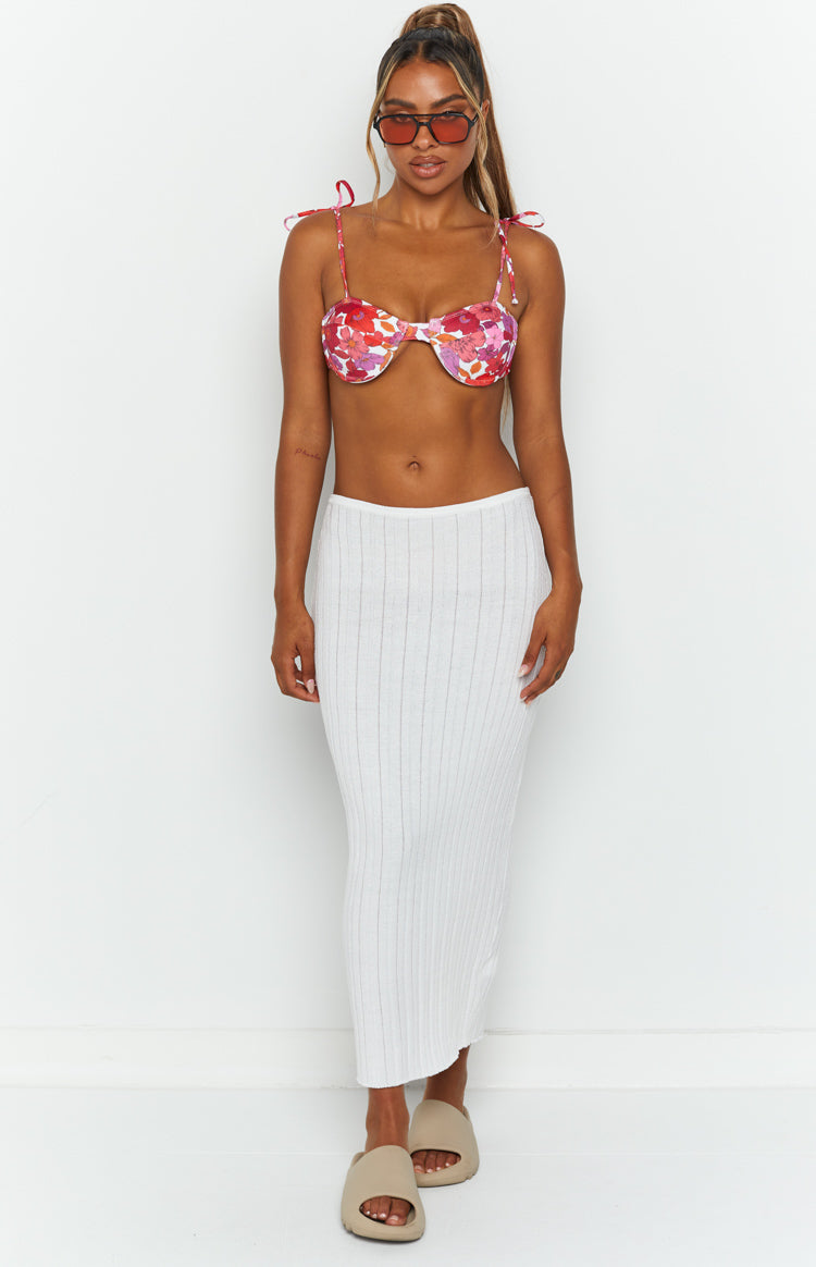 Front view of a white ribbed knit midi skirt with a high waist and a straight, fitted silhouette