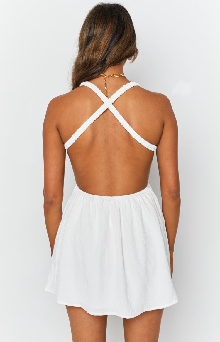 White crinkle mini dress with an open back and criss-cross textured shoulder straps