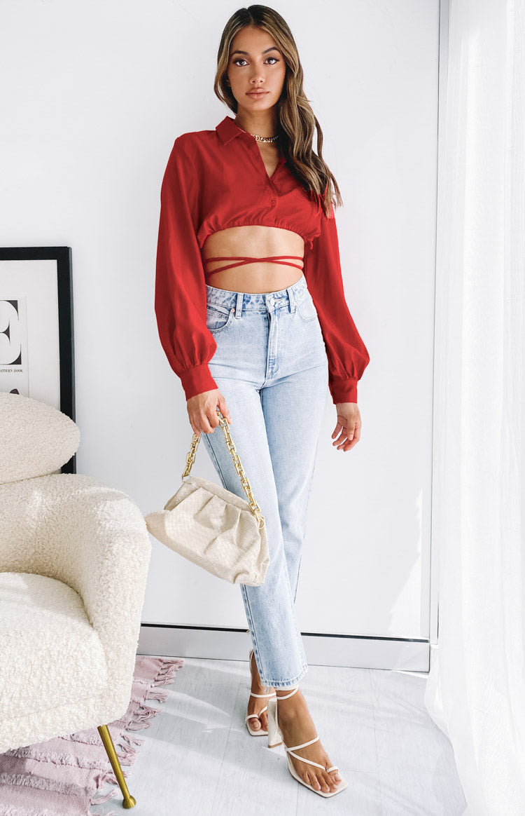 Red collared V-neck crop top with long sleeves, elasticated cuffs, and a tie-waist detail