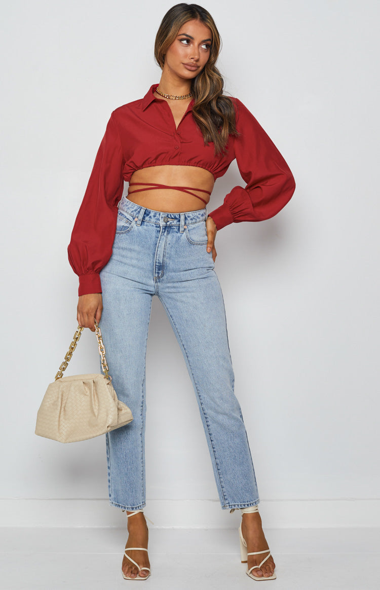 Red collared crop top with long voluminous sleeves and wrap-around waist ties