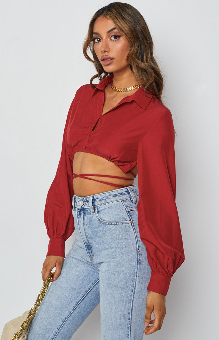 Red collared crop top with long balloon sleeves, fitted cuffs, and wrap-around waist ties