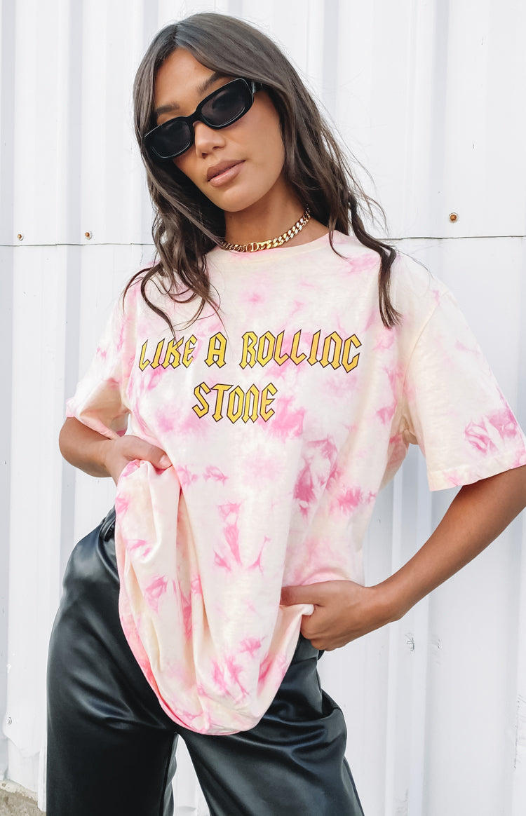 Pink tie-dye oversized tee with yellow 'LIKE A ROLLING STONE' graphic print