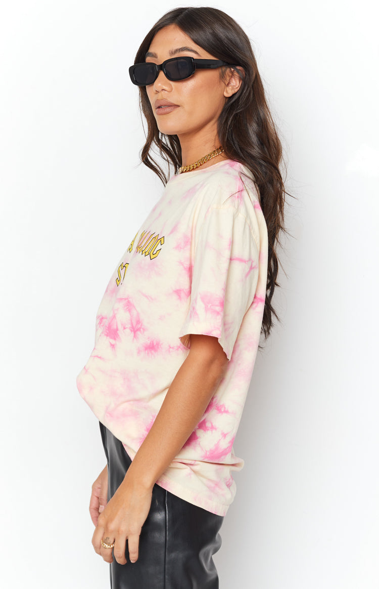 Pink and cream tie-dye oversized t-shirt with short sleeves and a yellow graphic print