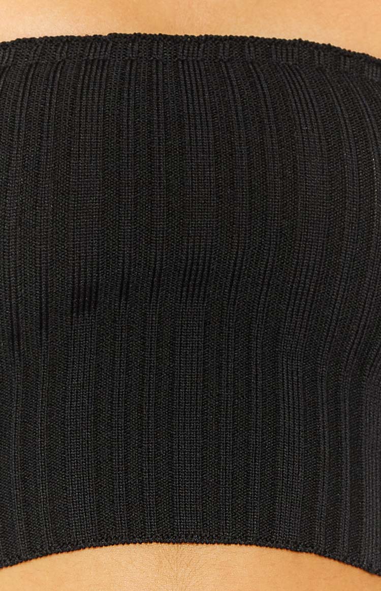 Close-up of the black ribbed knit fabric of the bandeau top