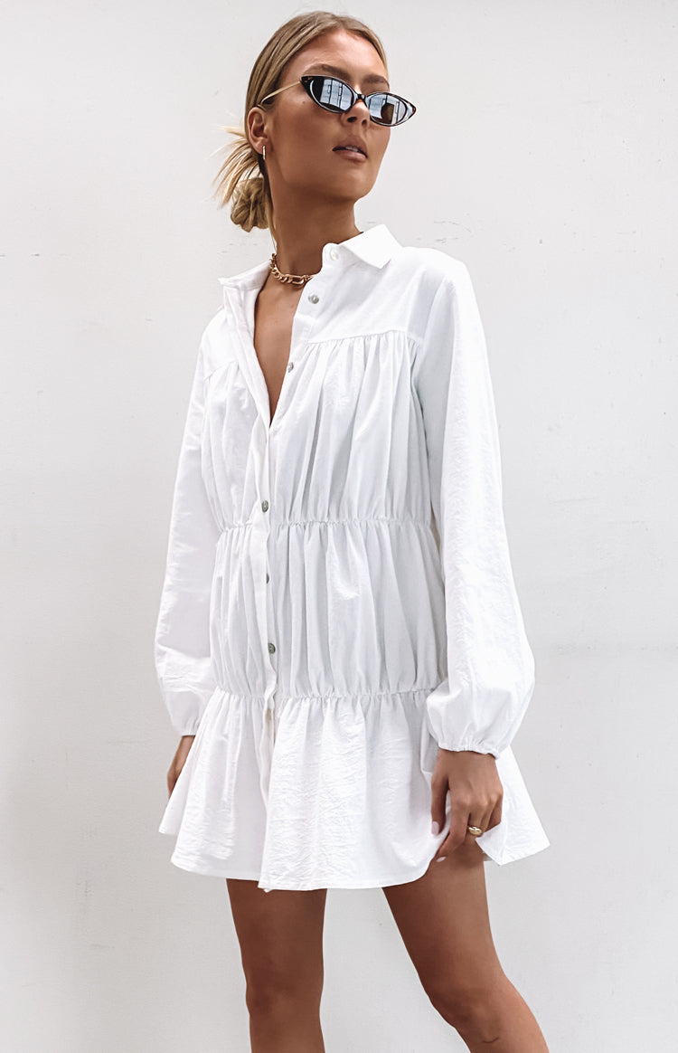 White Theodossia Tiered Long Sleeve Dress with a collared V-neck, button-front, and balloon sleeves