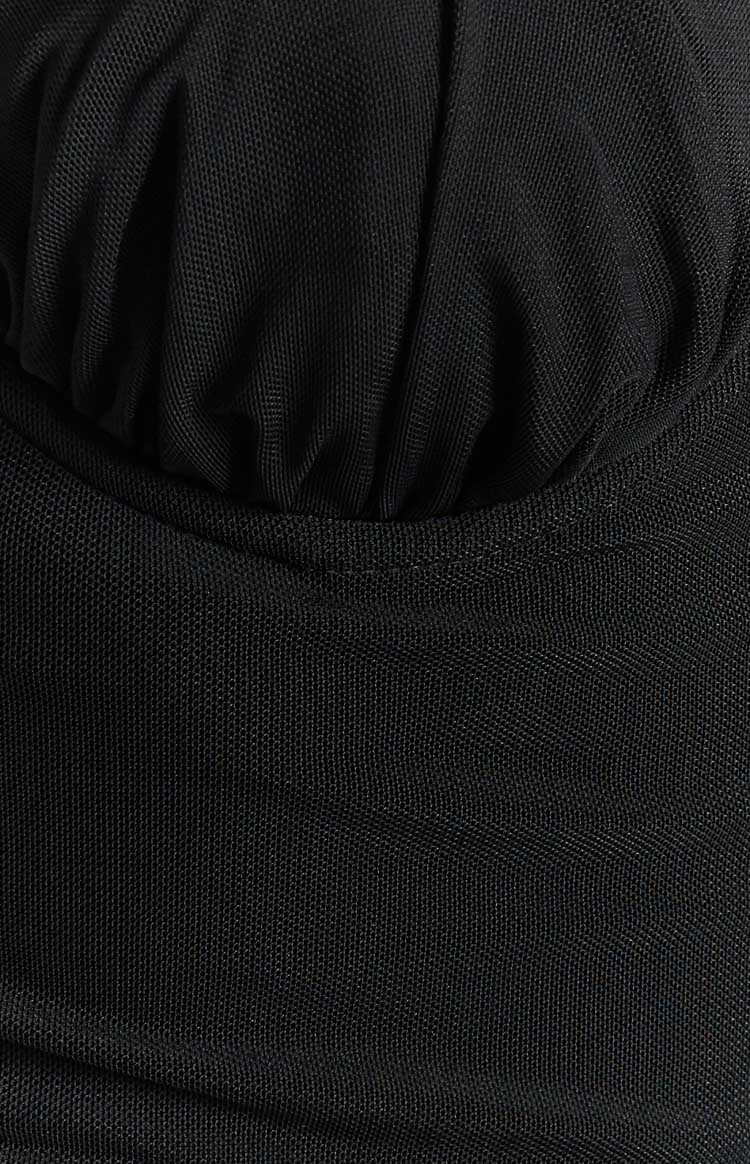Close-up of the black mesh fabric texture and a ruched detail on the midi dress