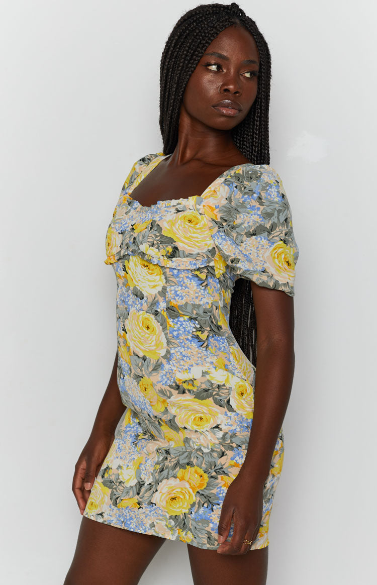 Yellow and blue floral mini dress with sweetheart neckline, short puff sleeves, and ruched bust detail