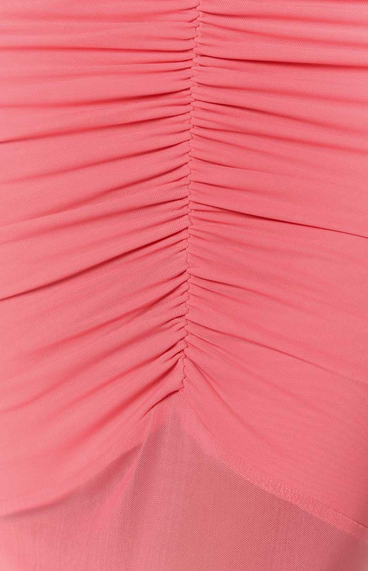 Close-up of the vertical ruching detail on the pink mesh fabric of the maxi dress