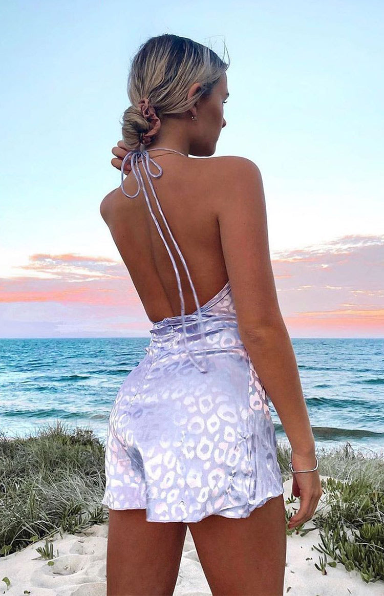 Lilac leopard print satin mini dress with thin halter neck ties and a ruched open back