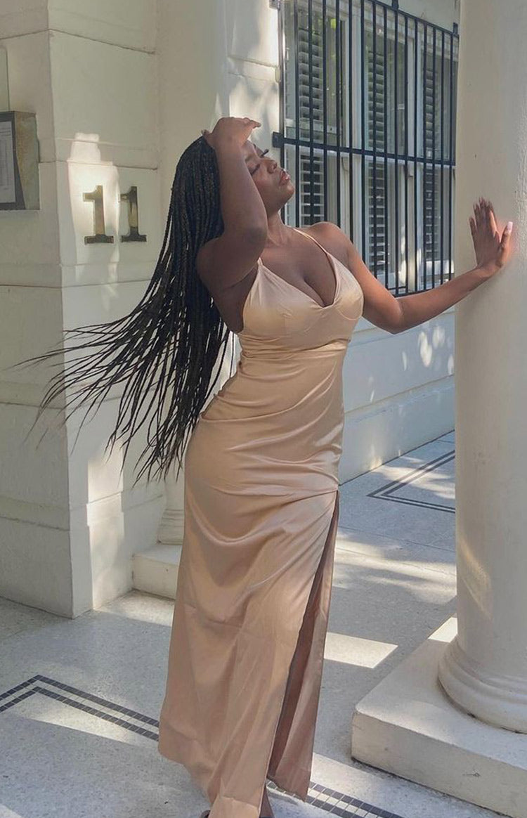Champagne silky maxi dress with a cupped V-neck, spaghetti straps, and a high side slit