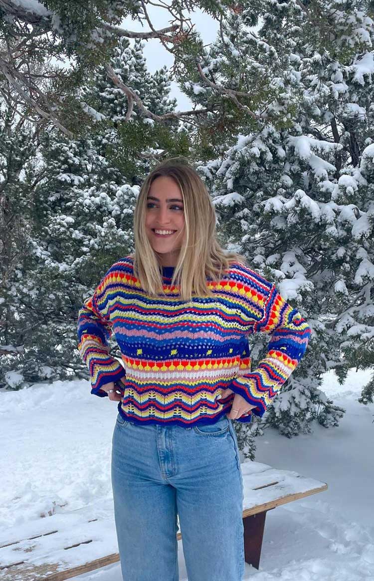 Cropped multi-colour knit sweater with horizontal zig-zag and heart stripes, a crew neck, and long sleeves