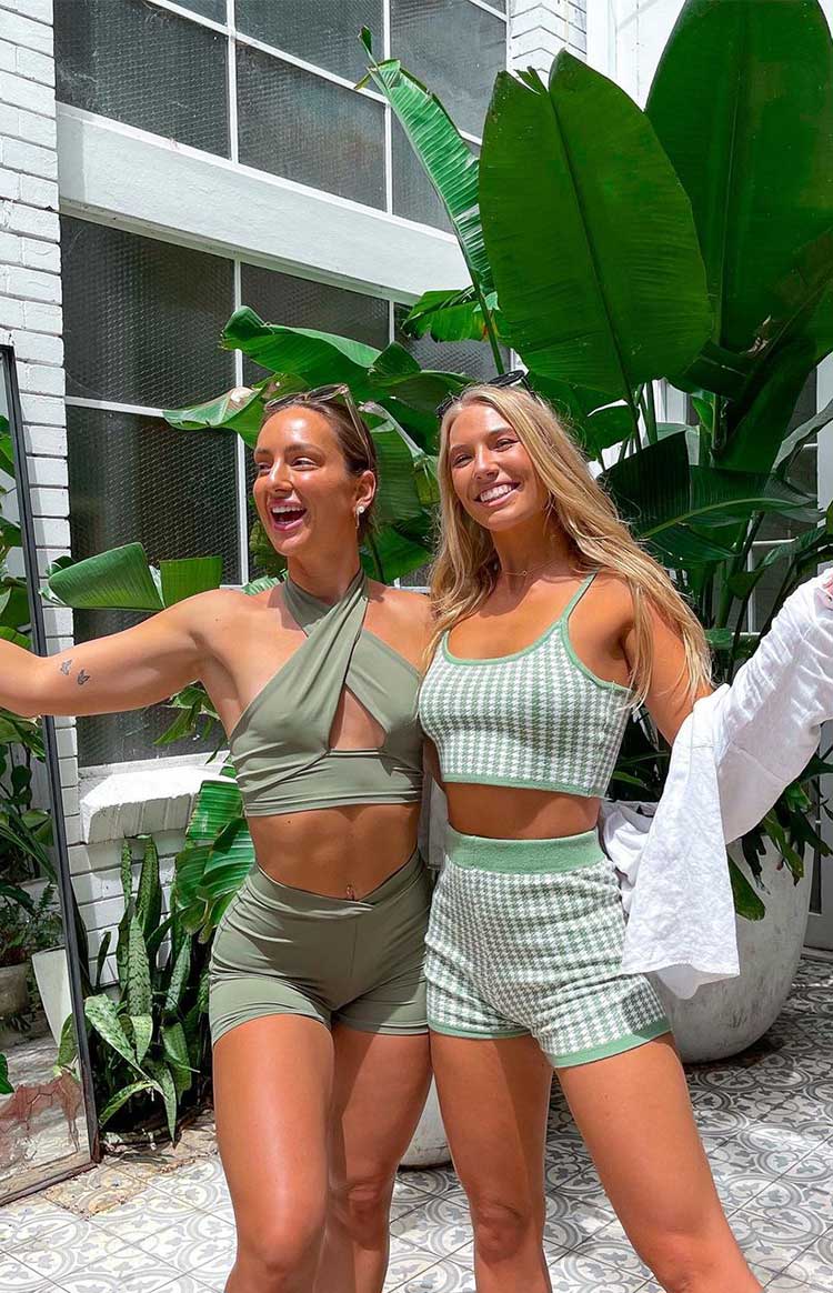 Khaki wrap-style halter crop top with a front triangular cutout