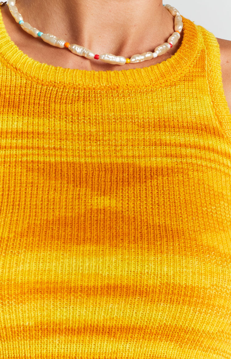 Round neck yellow ribbed knit tank top with horizontal tie-dye stripes