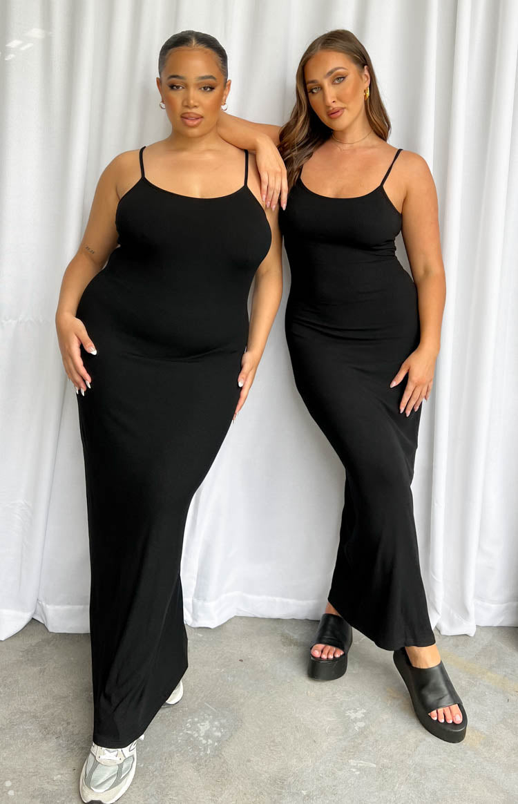 Fitted black maxi dress with a scoop neckline and thin spaghetti straps