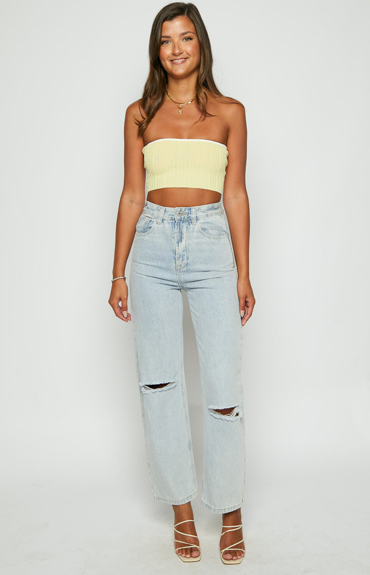 Front view of the cropped yellow ribbed knit tube top with white contrast binding